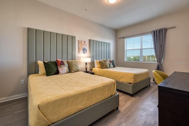 4013 Breakview Dr Unit A407, Orlando, FL 32819 - bedroom with wood finished floors and baseboards