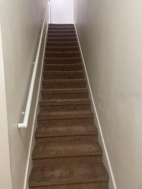 417 Southern Pecan Cir Unit 201, Winter Garden, FL 34787 - staircase with wood finished floors and baseboards