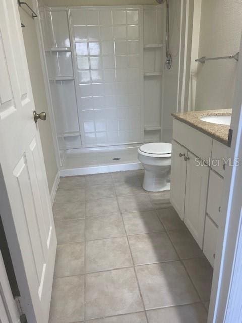 417 Southern Pecan Cir Unit 201, Winter Garden, FL 34787 - full bathroom with tile patterned flooring, toilet, a shower stall, and vanity