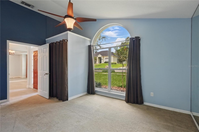 unfurnished bedroom featuring carpet floors, baseboards, and a ceiling fan