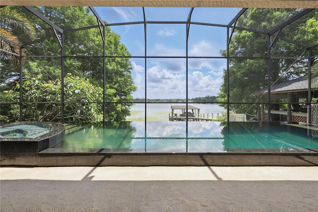 view of pool featuring an in-ground hot tub and a water view