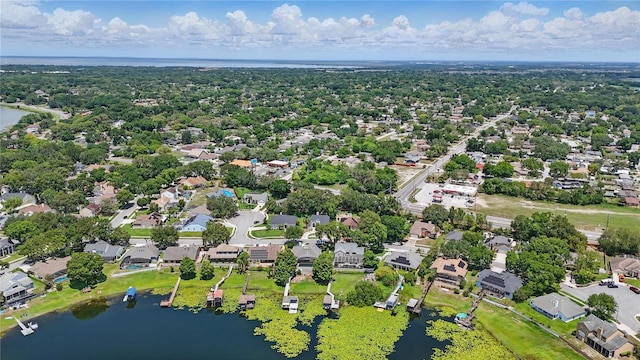 aerial view of residential area featuring a large body of water