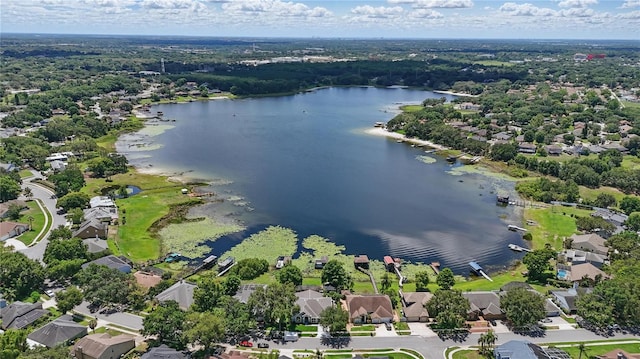 aerial view of residential area with a large body of water
