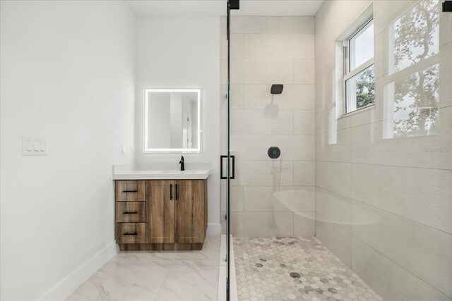 4528 Yorkshire Ln, Kissimmee, FL 34758 - full bathroom featuring vanity, tiled shower, baseboards, and marble look tile flooring