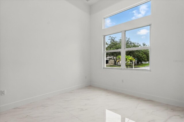 4528 Yorkshire Ln, Kissimmee, FL 34758 - spare room with marble finish floors and baseboards