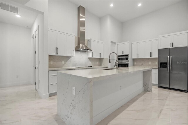 4528 Yorkshire Ln, Kissimmee, FL 34758 - kitchen with appliances with stainless steel finishes, wall chimney exhaust hood, light marble finish flooring, a sink, and a high ceiling