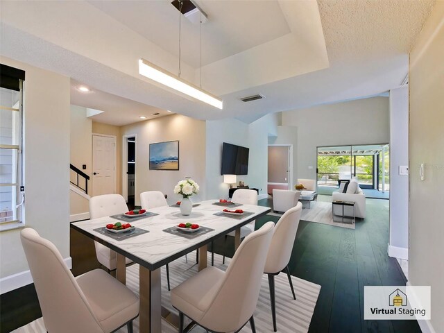 208 Frinton Cv, Longwood, FL 32779 - dining room featuring baseboards, hardwood / wood-style floors, a raised ceiling, and recessed lighting