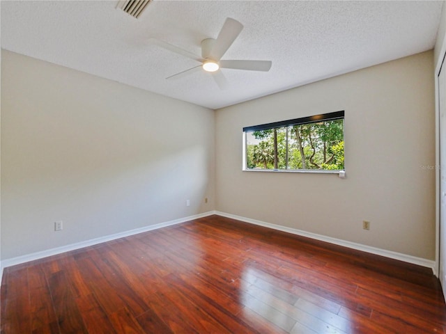 208 Frinton Cv, Longwood, FL 32779 - empty room with ceiling fan, baseboards, wood finished floors, and a textured ceiling