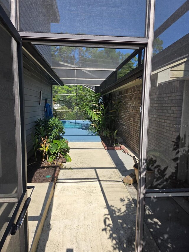208 Frinton Cv, Longwood, FL 32779 - view of patio featuring an outdoor pool and glass enclosure