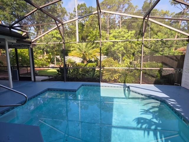 208 Frinton Cv, Longwood, FL 32779 - outdoor pool featuring a lanai and a patio area