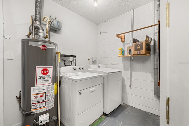 11811 Scarecrow Ln, Orlando, FL 32821 - washroom featuring gas water heater, concrete block wall, a textured ceiling, and washer and clothes dryer