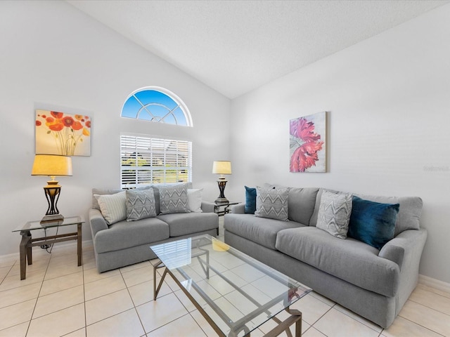 2115 Morning Star Dr, Clermont, FL 34714 - living area with baseboards, light tile patterned floors, and high vaulted ceiling