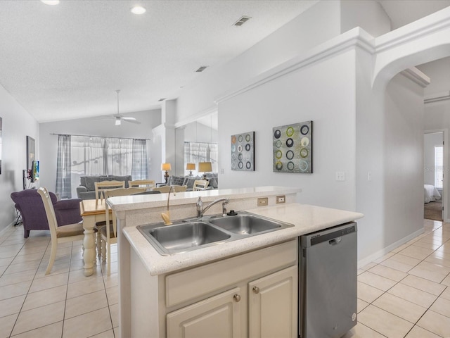 2115 Morning Star Dr, Clermont, FL 34714 - kitchen with stainless steel dishwasher, open floor plan, a sink, light tile patterned floors, and a center island with sink