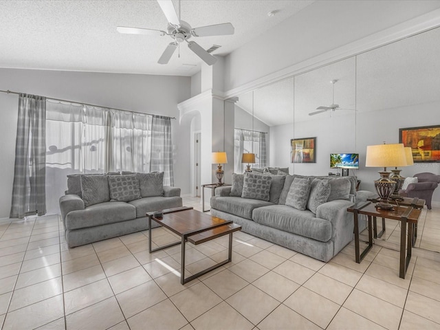 2115 Morning Star Dr, Clermont, FL 34714 - living area with a ceiling fan, light tile patterned floors, a textured ceiling, and high vaulted ceiling