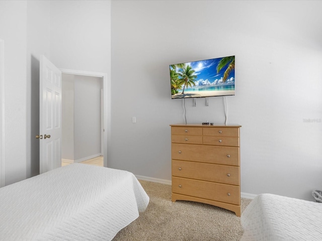 2115 Morning Star Dr, Clermont, FL 34714 - bedroom with light colored carpet and baseboards