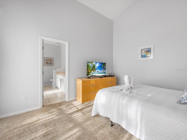 2115 Morning Star Dr, Clermont, FL 34714 - bedroom with high vaulted ceiling, light colored carpet, baseboards, light tile patterned floors, and ensuite bathroom