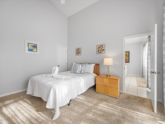 2115 Morning Star Dr, Clermont, FL 34714 - bedroom featuring light carpet, high vaulted ceiling, baseboards, and light tile patterned floors