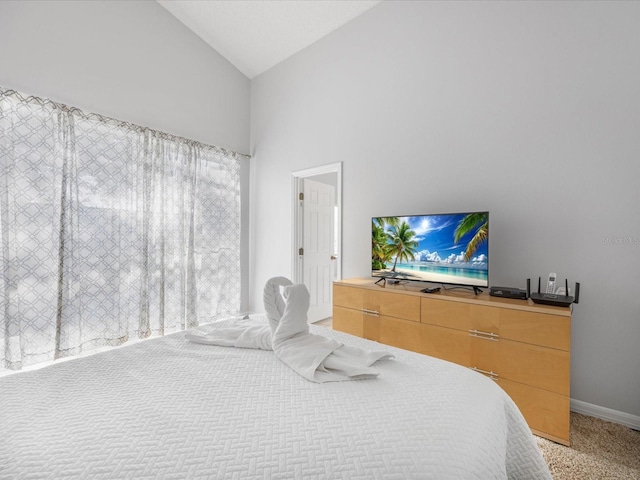 2115 Morning Star Dr, Clermont, FL 34714 - bedroom with light carpet, high vaulted ceiling, and baseboards