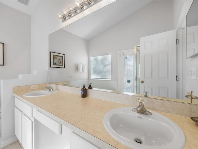 2115 Morning Star Dr, Clermont, FL 34714 - bathroom with a stall shower, vaulted ceiling, and double vanity