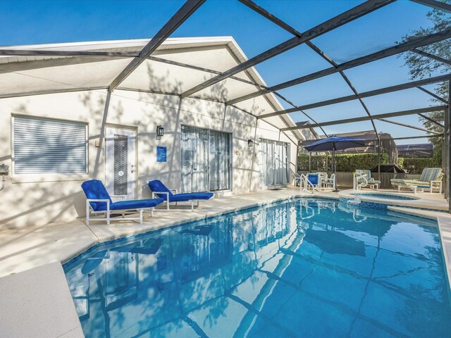 2115 Morning Star Dr, Clermont, FL 34714 - view of pool featuring a patio area, a lanai, and a pool with connected hot tub