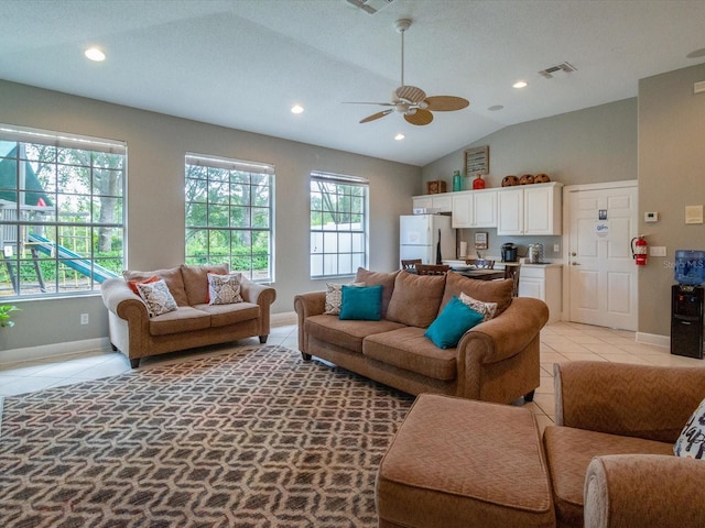2115 Morning Star Dr, Clermont, FL 34714 - living area with healthy amount of natural light, baseboards, ceiling fan, light tile patterned floors, and vaulted ceiling