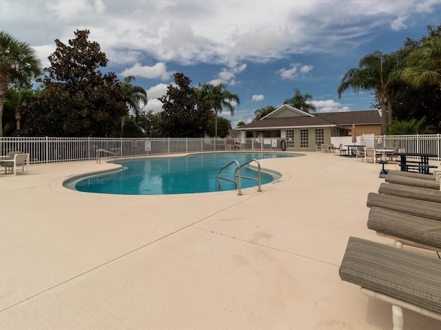 2115 Morning Star Dr, Clermont, FL 34714 - community pool featuring a patio