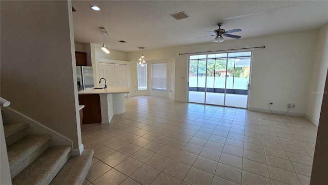 12126 Diedra Ct, Orlando, FL 32825 - unfurnished living room with a sink, light tile patterned floors, a ceiling fan, baseboards, and recessed lighting