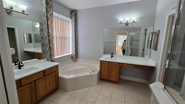 12126 Diedra Ct, Orlando, FL 32825 - bathroom with a shower stall, tile patterned flooring, a bath, and two vanities
