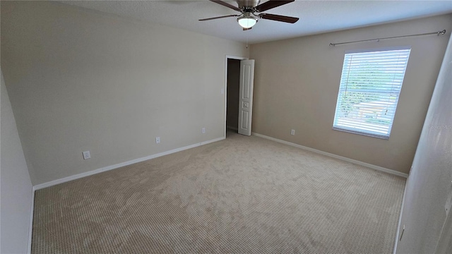 12126 Diedra Ct, Orlando, FL 32825 - unfurnished room with ceiling fan, light colored carpet, and baseboards