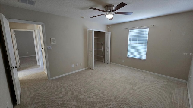 12126 Diedra Ct, Orlando, FL 32825 - unfurnished bedroom with carpet flooring, a closet, baseboards, and a ceiling fan