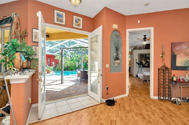 14680 Linden Dr, Spring Hill, FL 34609 - entryway with a sunroom, a ceiling fan, wood finished floors, and baseboards
