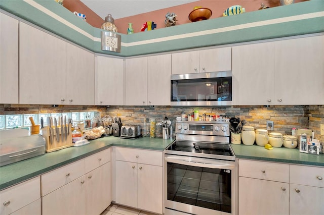 14680 Linden Dr, Spring Hill, FL 34609 - kitchen with stainless steel appliances, tasteful backsplash, and dark countertops