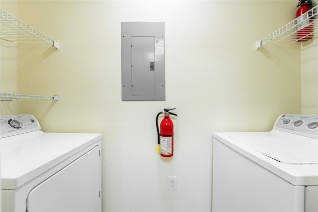 5447 Vineland Rd Unit 1308, Orlando, FL 32811 - washroom featuring electric panel and washer and dryer