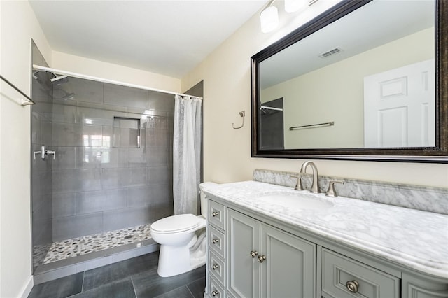 5447 Vineland Rd Unit 1308, Orlando, FL 32811 - bathroom with toilet, vanity, and tiled shower