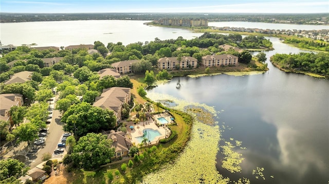 bird's eye view of a nearby body of water and a pool