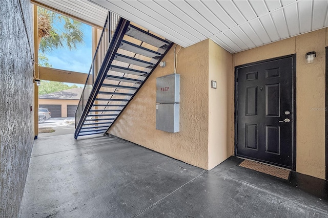 doorway to property with stucco siding