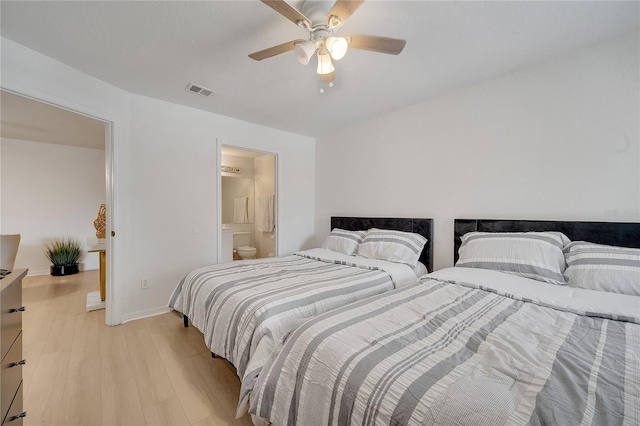 bedroom featuring light wood finished floors, baseboards, and ceiling fan