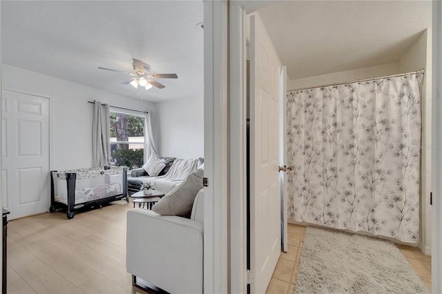 living area with a ceiling fan