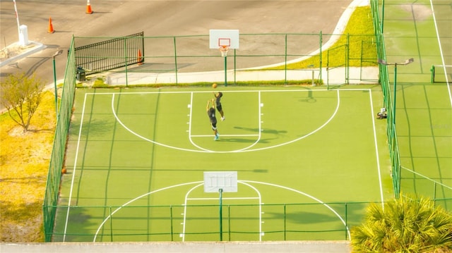view of basketball court with fence and community basketball court