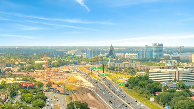 view of property location featuring a major roadway and nearby urban area