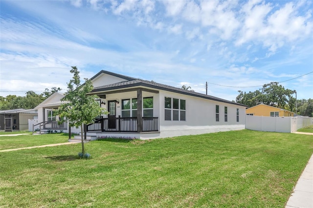 1050 20th St, Orlando, FL 32805 - rear view of house with stucco siding and covered porch