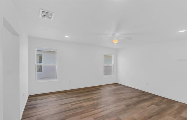 1050 20th St, Orlando, FL 32805 - spare room featuring a ceiling fan, wood finished floors, baseboards, and recessed lighting
