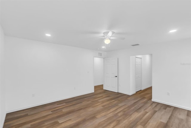 1050 20th St, Orlando, FL 32805 - unfurnished room featuring ceiling fan, wood finished floors, recessed lighting, and baseboards