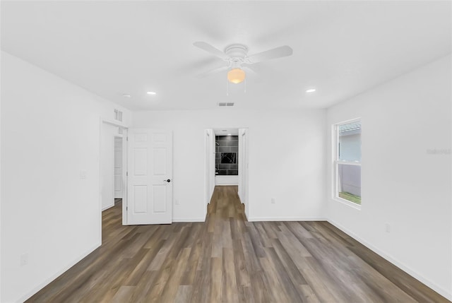 1050 20th St, Orlando, FL 32805 - unfurnished room with wood finished floors, ceiling fan, baseboards, and recessed lighting