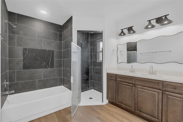 1050 20th St, Orlando, FL 32805 - bathroom with vanity, wood finished floors, and shower / bathtub combination