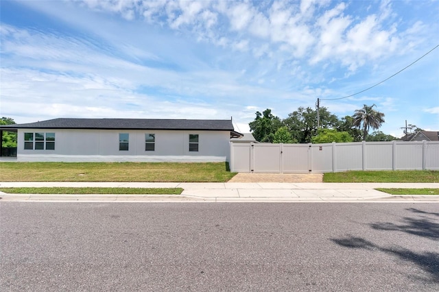 1050 20th St, Orlando, FL 32805 - view of front of house with a gate and stucco siding