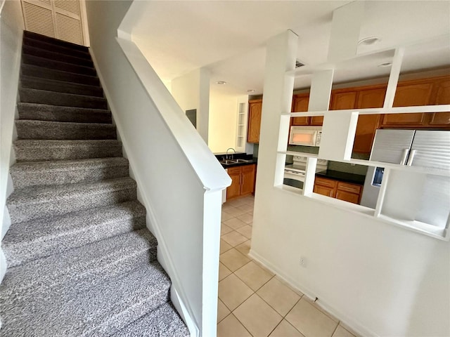 stairs featuring tile patterned floors