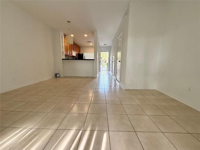 unfurnished living room with light tile patterned floors and recessed lighting