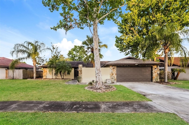 2006 Sycamore Ln, Plant City, FL 33563 - view of front of property featuring a garage, concrete driveway, and stone siding
