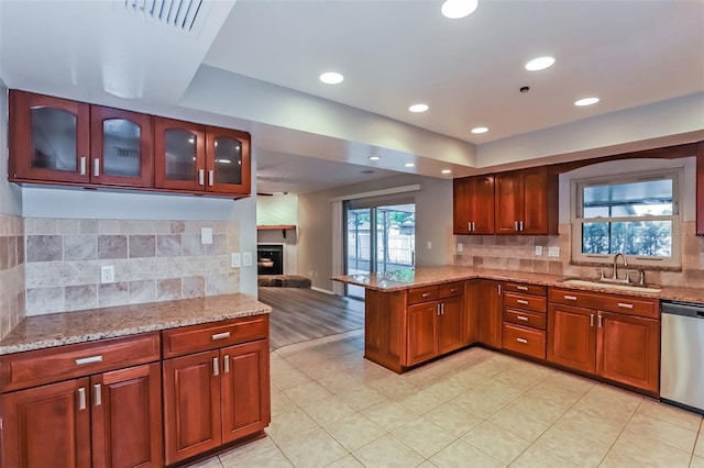 2006 Sycamore Ln, Plant City, FL 33563 - kitchen with a sink, dishwasher, a peninsula, tasteful backsplash, and recessed lighting